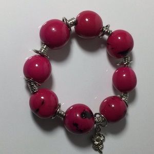Cute Tagua Seed bracelet fuchsia. 10% discount.